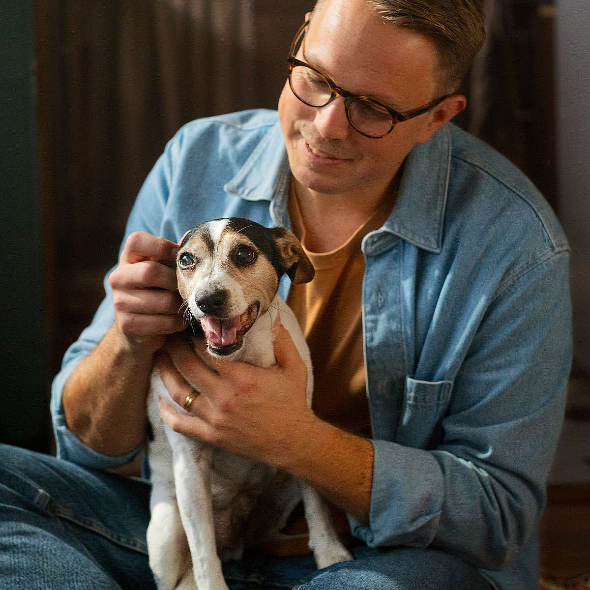 dog cuddling with human